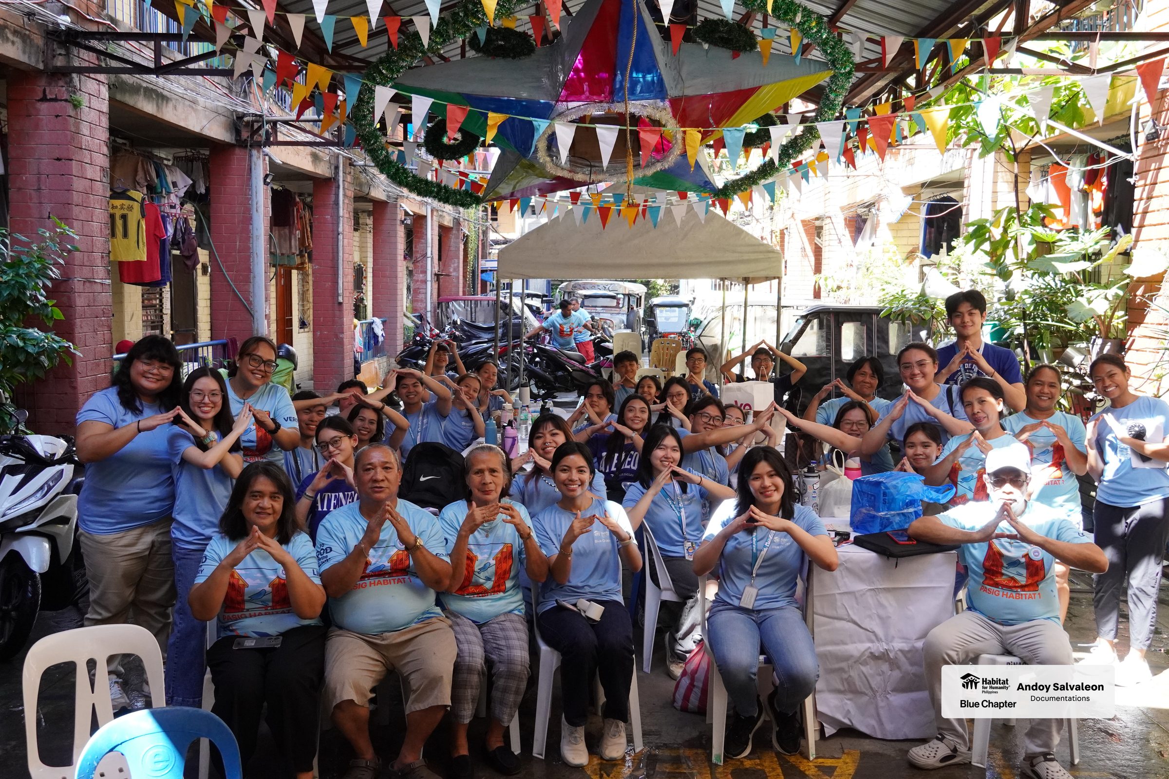 Members and residents together in the decorated alley after the game